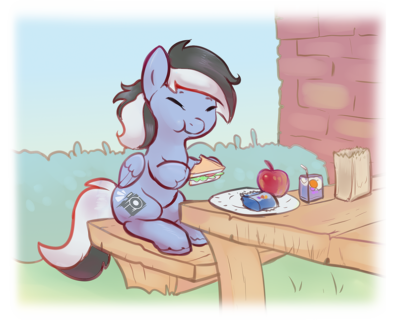 Sharpie sitting at a table eating a sandwich